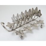 A late 19thC / early 20thC silver plate toast rack of foliate form with branches and leaf