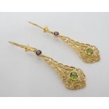 A pair of silver gilt drop earrings set with amethysts peridot and seed pearls 1 3/4" long