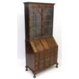 An early 20thC walnut bureau bookcase 36" wide x 80" high x 20 1/4" deep,