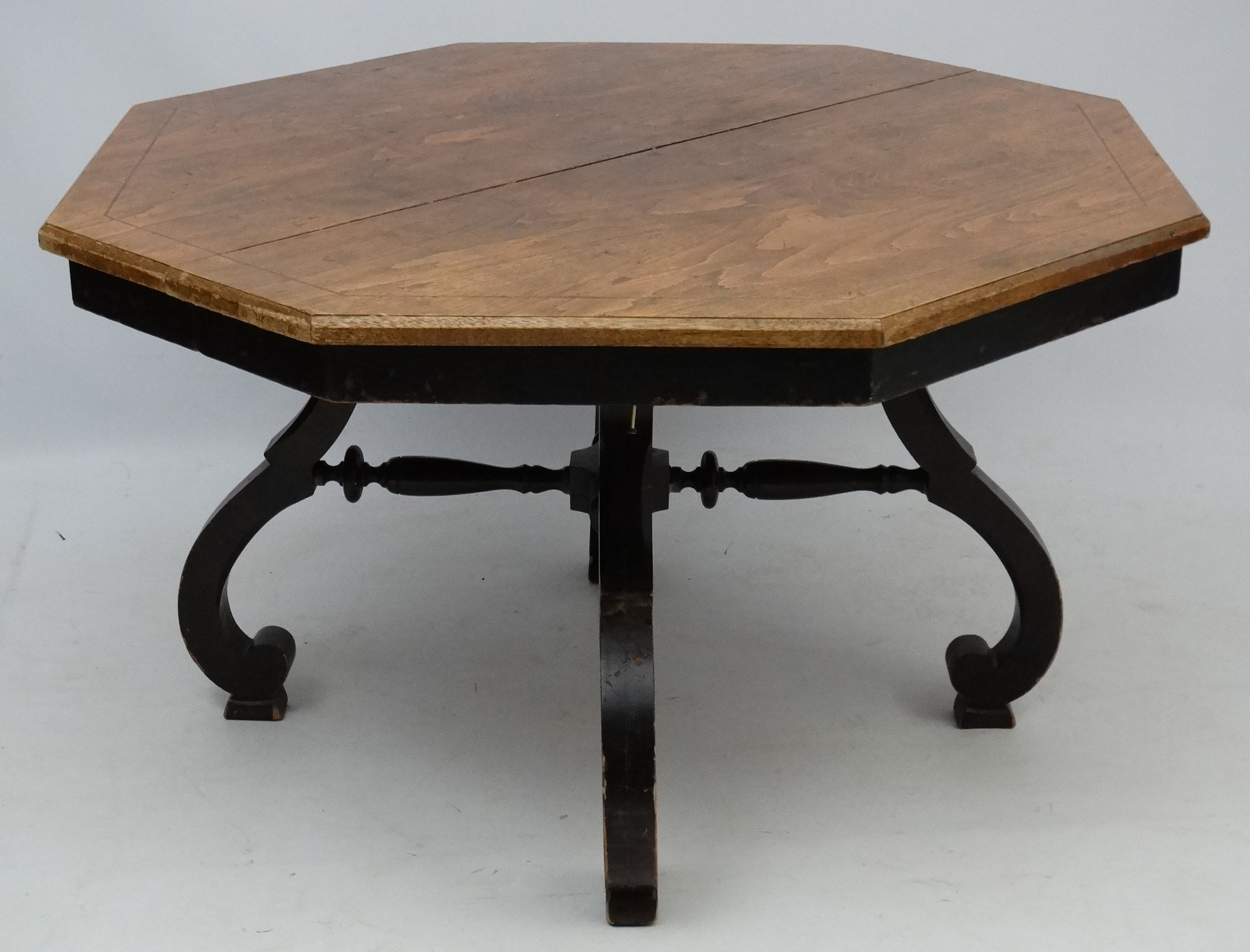 An early 20thC American octagonal oak topped four legged centre table with ebonised base, - Image 7 of 7