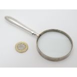 A silver handled magnifying glass 6" long overall CONDITION: Please Note - we do