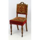 A late Victorian oak knocker chair with original carpet covered upholstery.