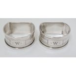 A Victorian pair of silver napkin rings with engine turned decoration hallmarked Birmingham 1933