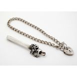 A silver bracelet with padlock clasp together with a silver tie clip having horse and jockey