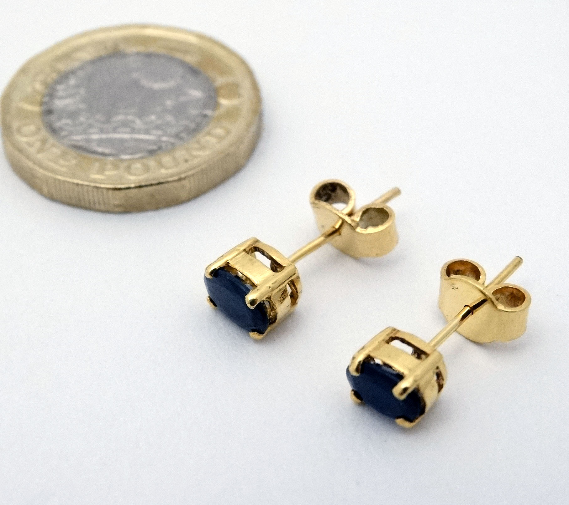 A pair of sapphire stud earrings with yellow metal mounts CONDITION: Please Note - - Image 3 of 3