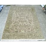 Carpet / Rug : a large hand made woollen carpet , with buff , beige , green , purple-red colours,