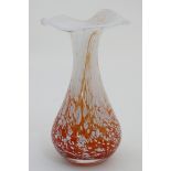 Scandinavian Glass : An art glass vase with orange red and white flecked decoration and flared rim.