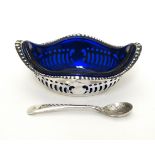 A silver plated salt with blue glass liner and silver plated salt spoon,