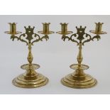 Decorative Metalware : A pair of 19thC Neogothic brass twin branch candelabra 10" high