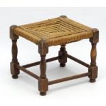 An early 20thC stool with seagrass top and stained beach construction.