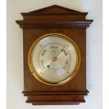 Negretti & Zambra Aneroid Barometer : a 20 th C Classical mahogany cased 6 1/2" silvered dial '