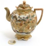 A Japanese Satsuma ware miniature teapot,