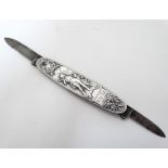 A late 19thC Swiss penknife with embossed aluminium sides and twin blades and decorated with image