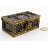 A c.1900 gilt metal and croc skin box opening to reveal a green velvet lined interior.