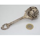 A .925 silver Victorian style child's rattle. Indistinctly marked.