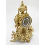 French 8 day ormolu Drum Clock : an ormolu cased 5" dialled clock , striking on a bell ,