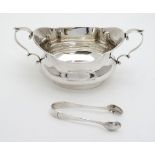 A silver sugar bowl with twin handles Hallmarked Birmingham 1911 maker Williams ( Birmingham) Ltd.