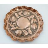 Arts and Crafts : An embossed copper circular dish in the manner of Keswick 7" diameter
