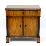 A late 19thC Biedermeier cupboard with fruitwood and ebonised decoration.