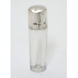 A glass scent bottle with silver screw top maker CC May & Sons.