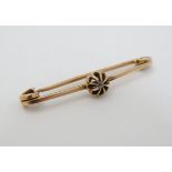 A gold brooch set with central diamond 1 3/4" long CONDITION: Please Note - we do