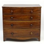 A Geo IV mahogany bow front chest of drawers comprising 2 short over three graduated long drawers