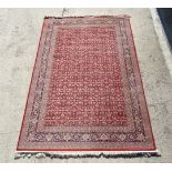 Rug / Carpet : a 20 thC Belgian Wilton rug with 5 bands around a wine red central ground.