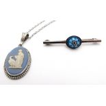 A silver brooch set with millifiore style cabochon together with a Wedgwood Jasperware pendant.
