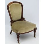 A mid - late Victorian walnut overstuffed nursing chair 34 1/2" high CONDITION: