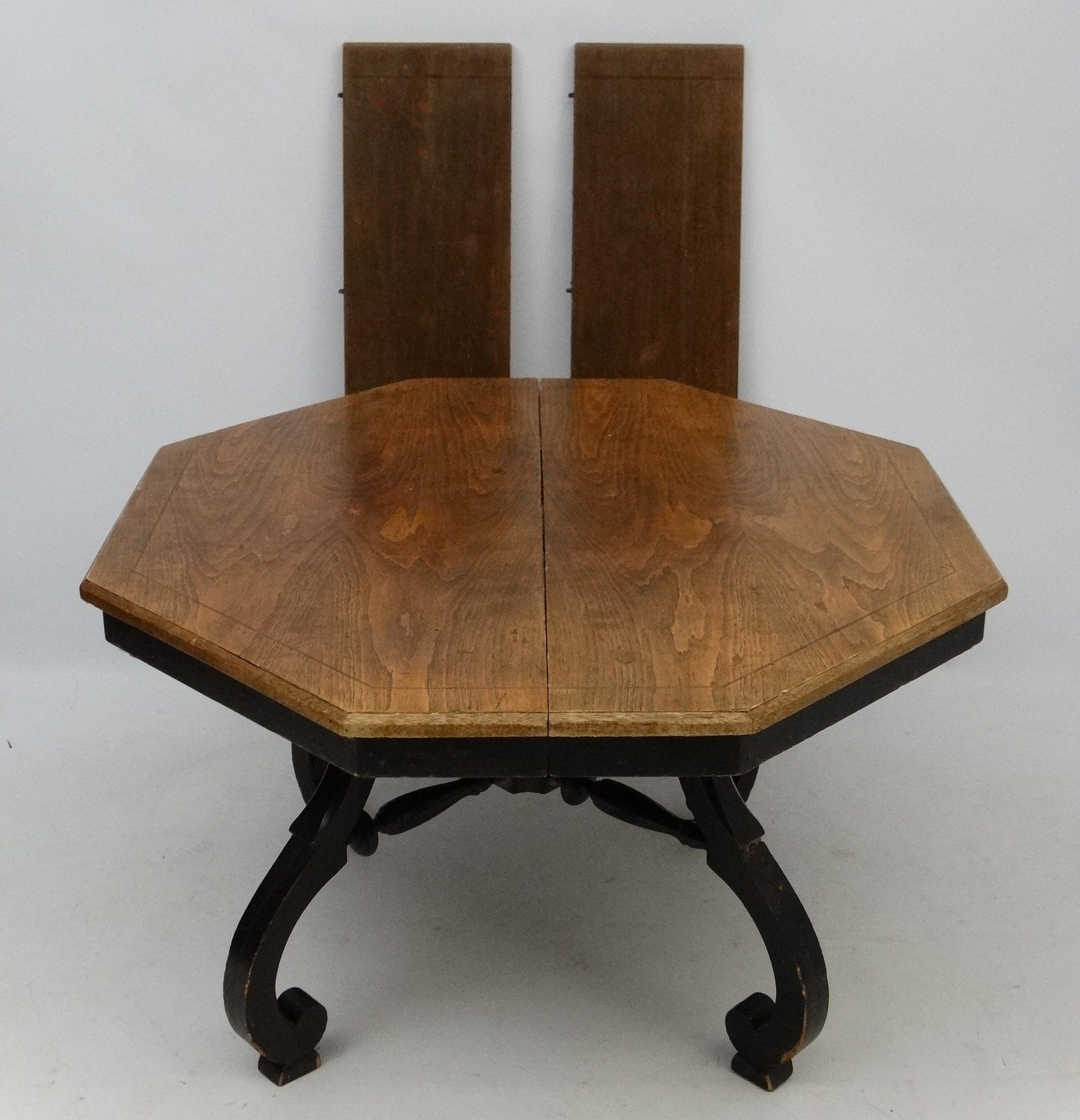 An early 20thC American octagonal oak topped four legged centre table with ebonised base, - Image 6 of 7
