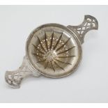 An American silver tea strainer Marked Sterling, numbered 657 Maker Meriden Brittania Co.
