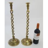 A pair of 20thC two-sectional open twist candlesticks on ring turned soccles standing 20 1/2" high