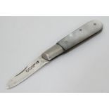 A small mother of pearl folding fruit knife with mother of pearl handle and silver blade hallmarked
