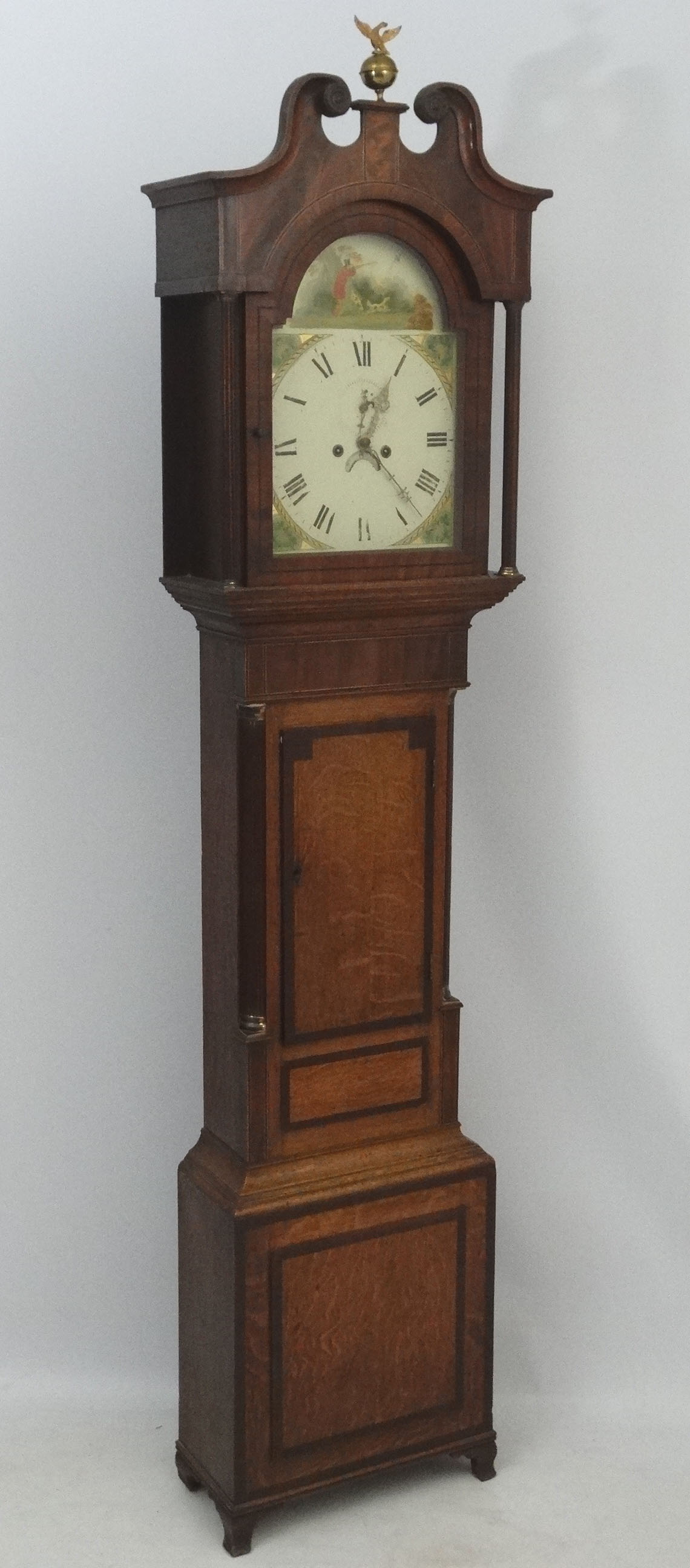 19thC longcase : a Grandfather Clock having a 13" break arch painted dial ( with figure shooting in