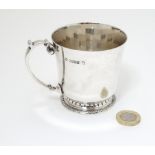 A silver Christening mug hallmarked Birmingham 1953 with Coronation mark. Maker Adie Bros Ltd.