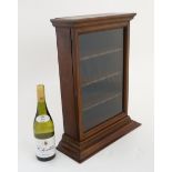 An early 20thC mahogany counter top glazed display cabinet 20 1/2" high x 16" wide x 6" deep