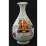 A Chinese famille rose vase with flared rim decorated with a sage like figure being played to by a