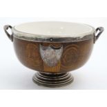 A 1920's oak and silverplate pedestal salad bowl with loop handles ,