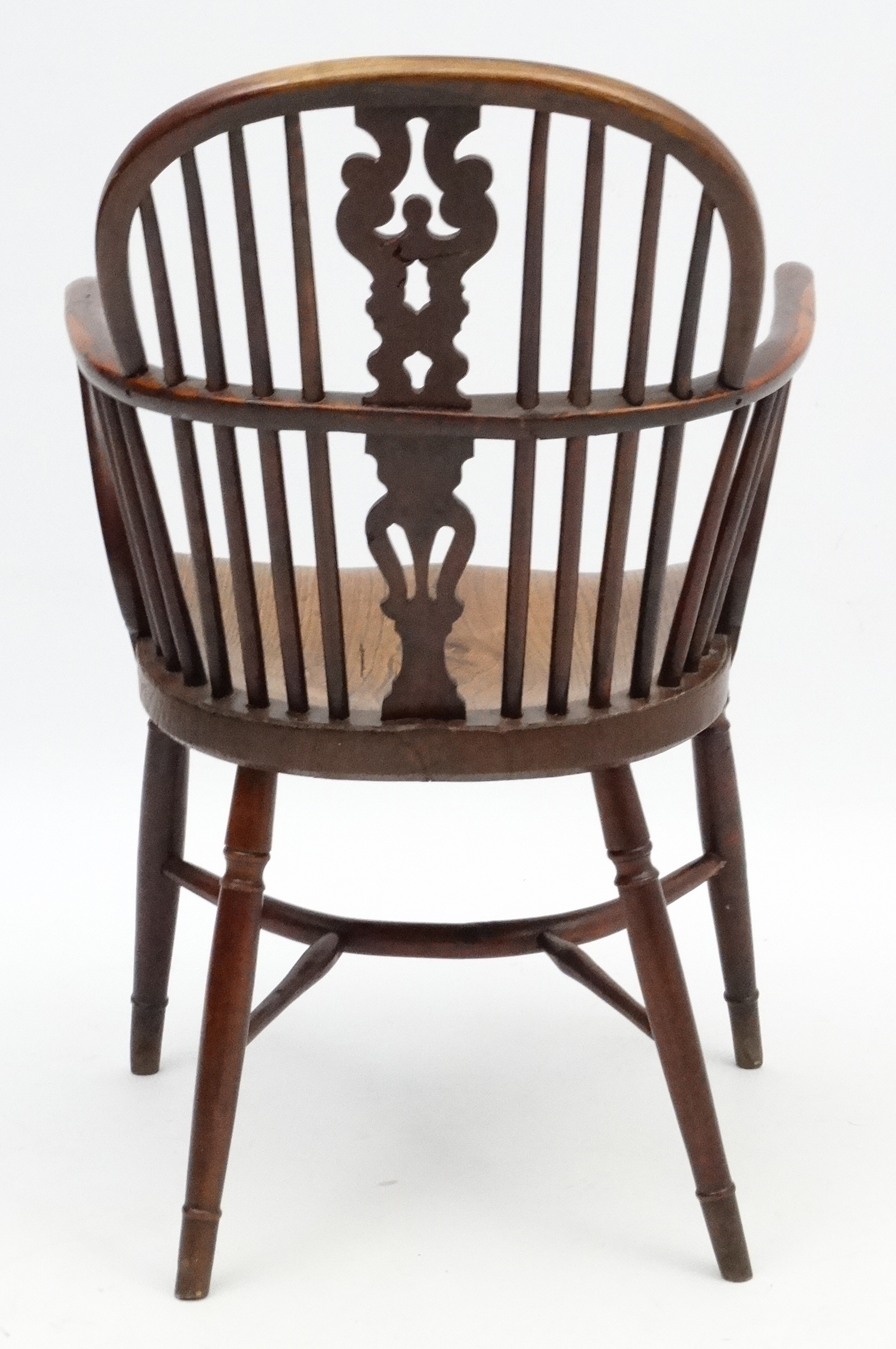 An 18thC Yew wood Windsor chair with elm seat shaped uprights and crinoline stretcher. - Image 2 of 4