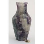 A tall baluster shaped vase of hardstone quartz like purple blue and dark green colours 7" high
