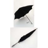 An Eastern white metal handled parasol umbrella 33" long CONDITION: Please Note -