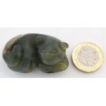A Chinese carved green jade figure of a recumbent cat 1 3/4" long CONDITION: Please
