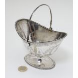 A Victorian silver sugar basket of neoclassical form on pedestal foot with engraved and beaded