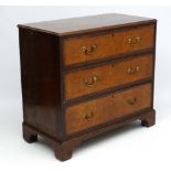 Holland & Sons : An 19thC mahogany and cross banded and burr elm three drawer chest of drawers.