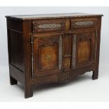 An 18thC Continental carved oak buffet with parquetry inlay,