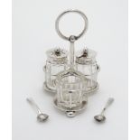 A silver three bottle cruet stand hallmarked Birmingham 1913 maker Maxfield & Sons Ltd.