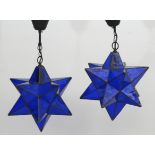A pair of blue glass 2-point pendant star hanging lights approx 11 1/4" diameter