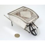 A novelty silver plate sugar box formed as a wheelbarrow with hinged lid 7 1/2" long