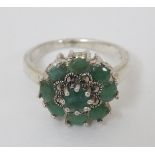 A silver ring set with green stones and marcasites CONDITION: Please Note - we do