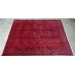 Carpet / Rug : A hand made woollen Bokara type Rug with wine red ground with midnight blue ,